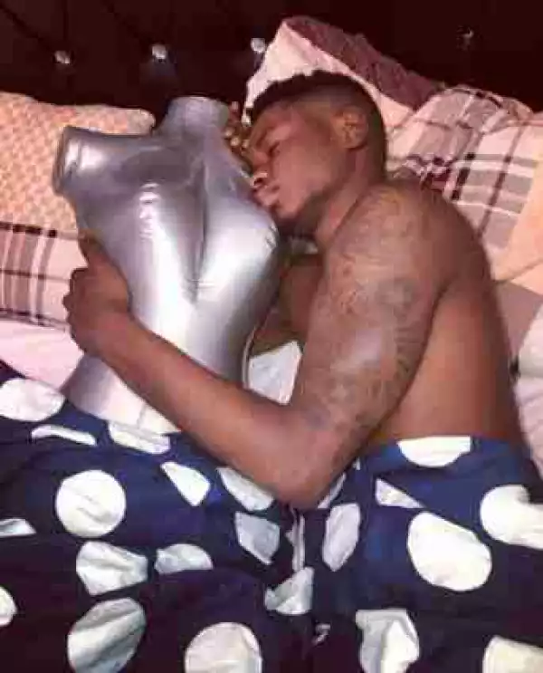 Lil Kesh In Bed With Mannequin As They Spend The Night Together (Photos)